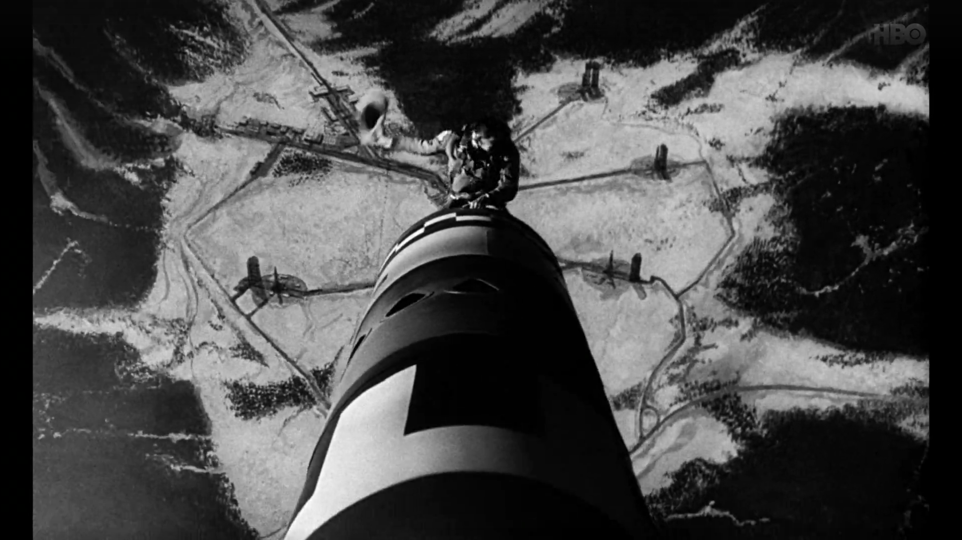 Screenshot from the film Dr. Strangelove in which Major T. J. “King” Kong rides a nuke down like a bucking bronko